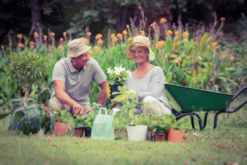 Community gardener tending raised beds in Sutton community garden